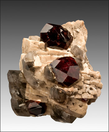 Spessartine Garnet with Smoky Quartz on Feldspar Shigar Valley Pakistan cabinet specimen